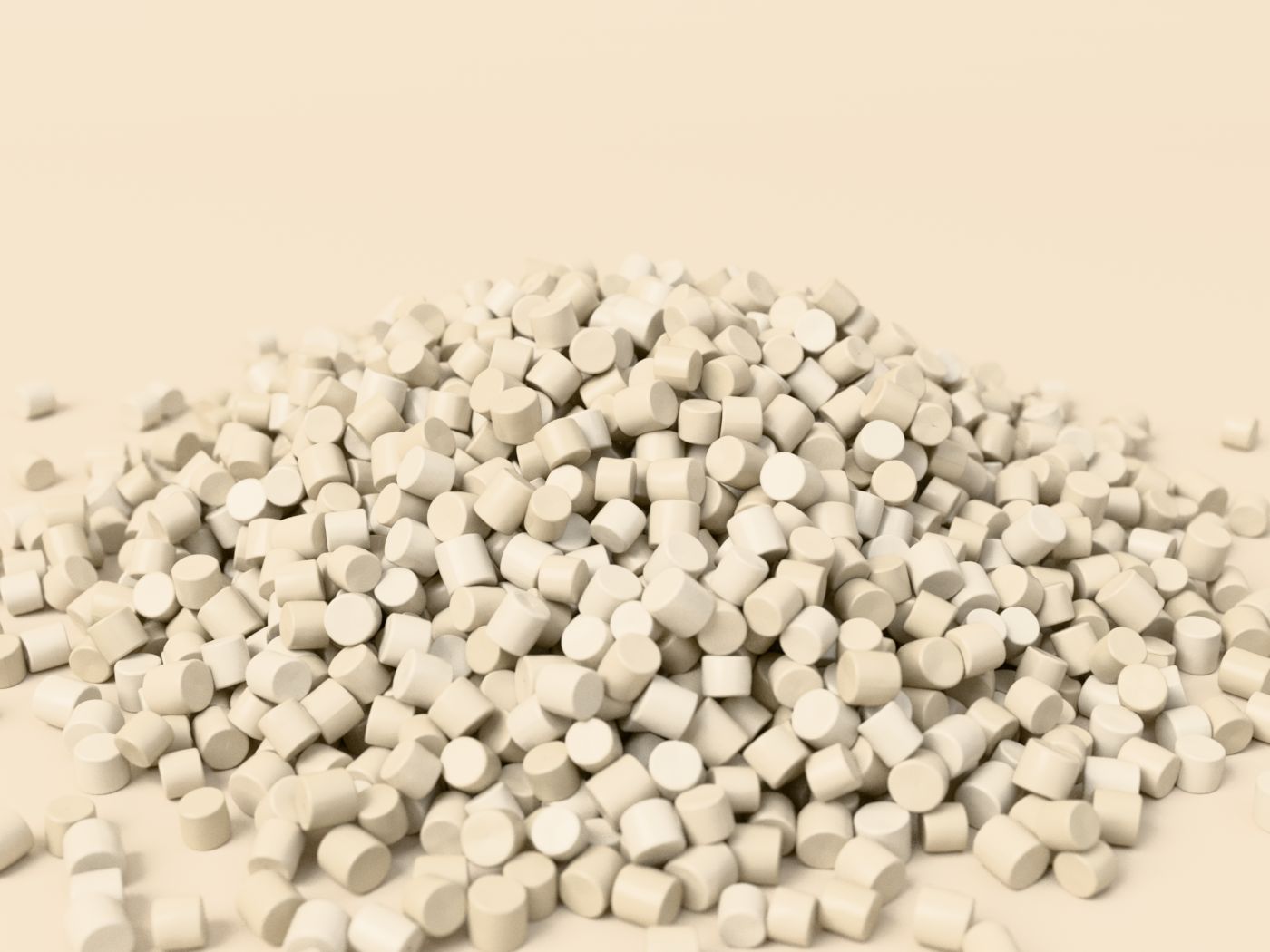A heap of off-white cylindrical HDPE granules on a sand-coloured surface